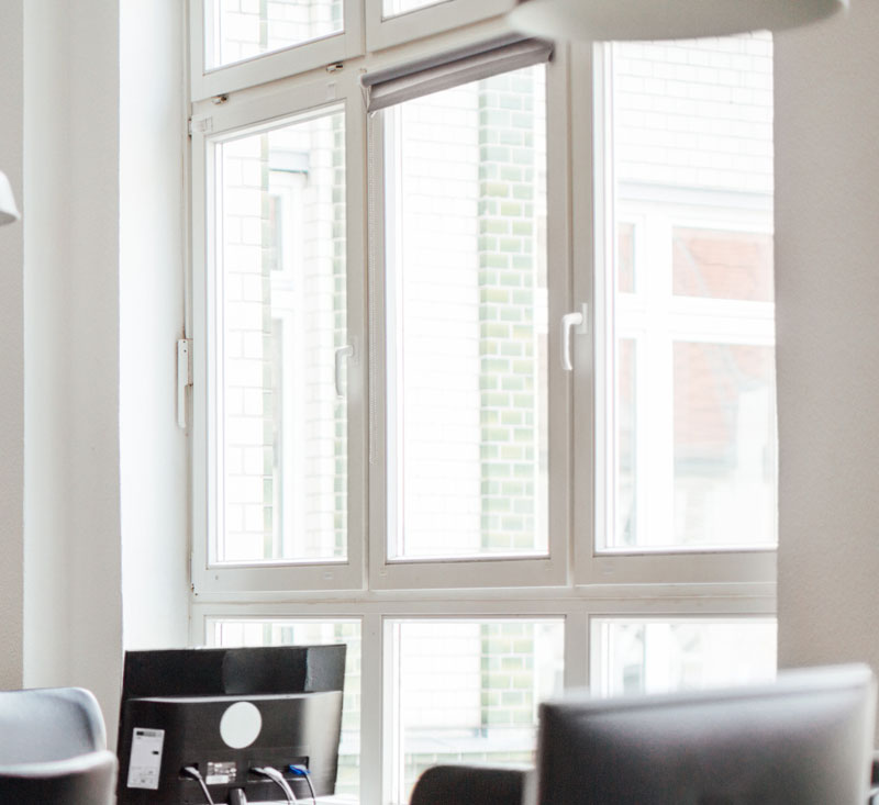 Office window with monitors - Commercial Glass Repair, Replacement & Tint Services